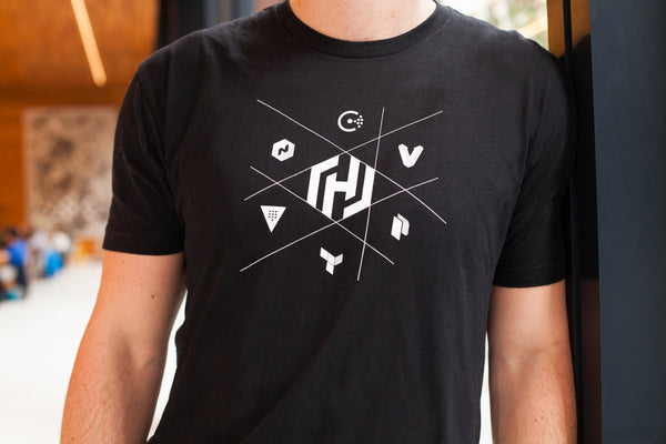 White Consul, Vagrant, Packer, Terraform, Vault, and Nomadl icons surround a white Hashicorp H icon on a black unisex t-shirt.